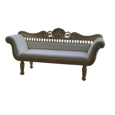 Low back loveseat with white leather upholstery, a carved shell crest, spindle rail and matte gold frame on turned legs