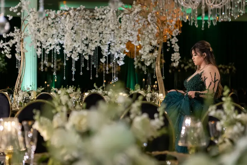 Emerald and black quinceañera with gold accents