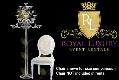 Crystal floor candelabra beside a white round-back chair, which is shown for size comparison and not included