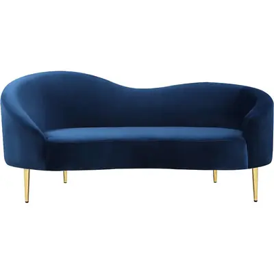Curved loveseat in navy blue suede with a low wavy back and slim gold legs, front view