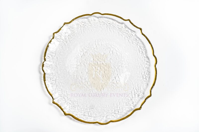 Clear glass charger plate with a scalloped seashell edge, gold rim and textured surface, shown from above
