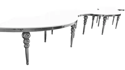 Serpentine table in sections with white glossy top and silver bubble legs