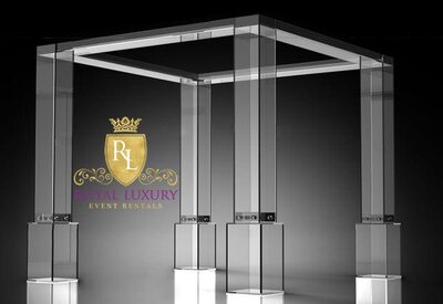 Square clear acrylic canopy with four hollow columns on glowing bases, shown in a studio rendering