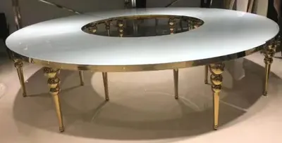 Full circle table with glossy white top, gold frame and gold bubble legs, shown with an open centre