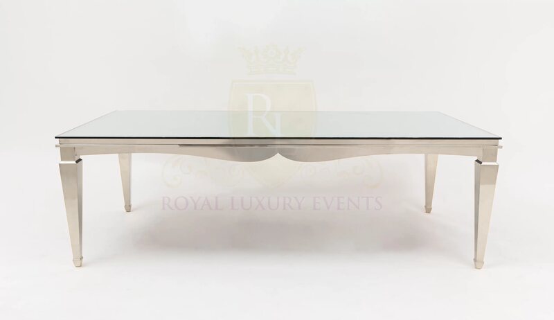 Rectangular dining table with polished silver frame, tapered legs and mirror glass top