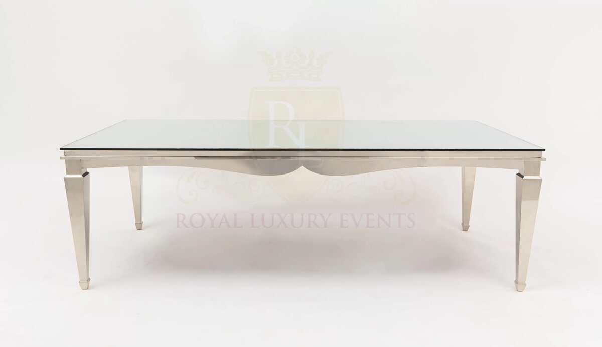 Rectangular dining table with polished silver frame, tapered legs and mirror glass top