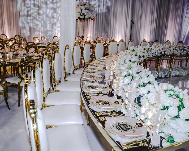 ceiling decor, cake drop, royal luxury, wedding reception decor, gold chairs, mirror tables, chargers, tableware, circle arch