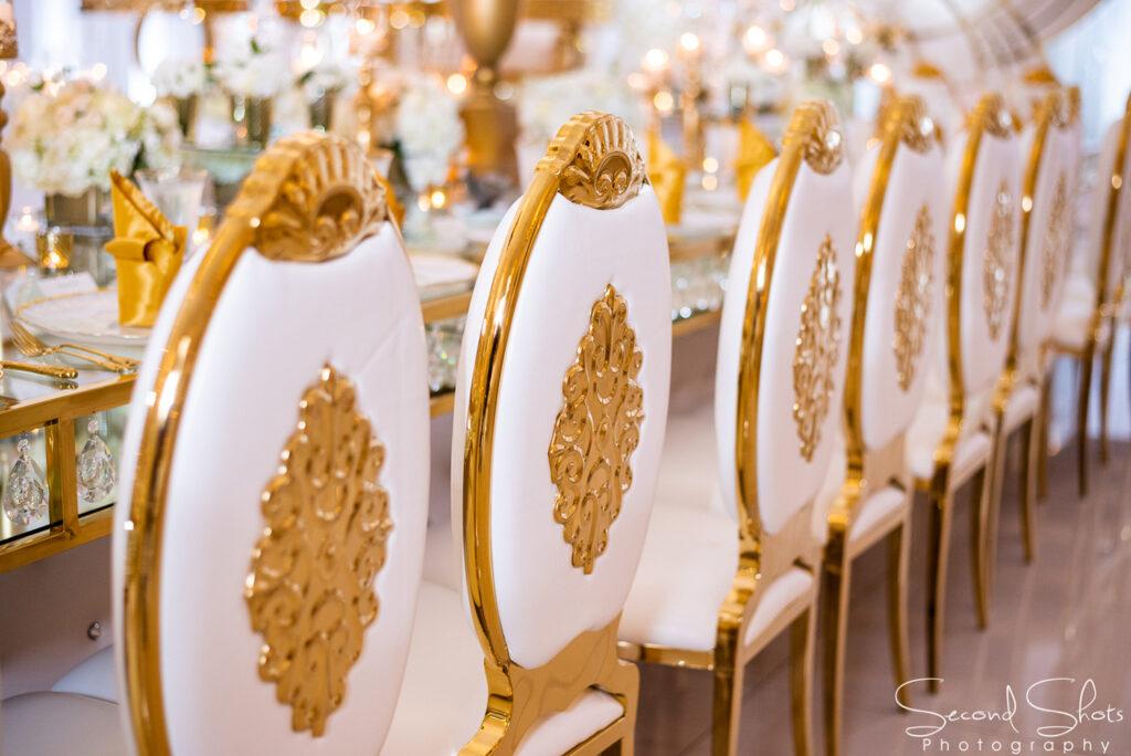 white and gold wedding decor - royal luxury events - rentals - flowers - gold chairs - fancy chairs