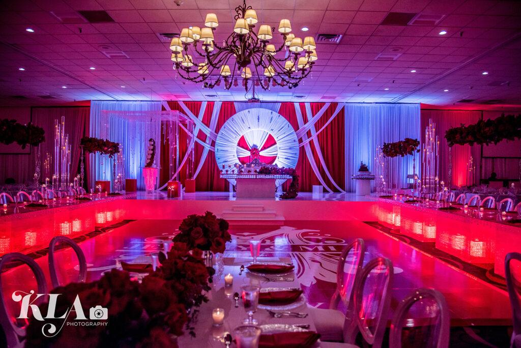 View Mia and Jeremy's stunning white and red wedding at MCM Elegante in Beaumont, Texas by Royal Luxury Events.
