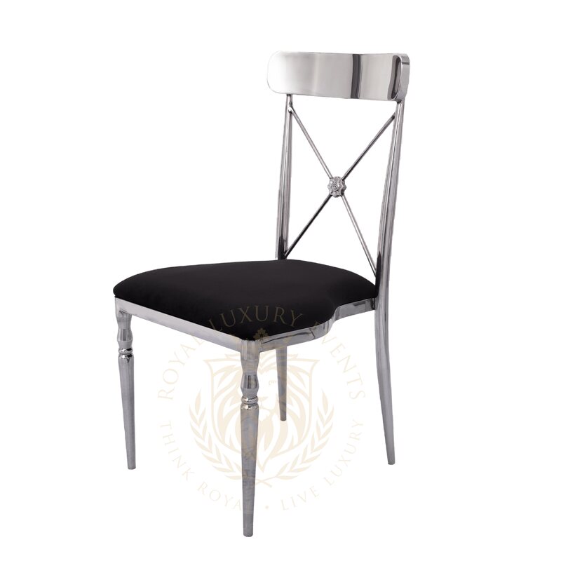 Cross-back chair with polished silver metal frame and black velvet seat, shown at a three-quarter angle