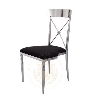 Cross-back chair with polished silver metal frame and black velvet seat, shown at a three-quarter angle