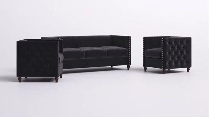 Black velvet lounge set with a three-seat sofa and two armchairs, tufted sides, nailhead trim and dark wooden legs