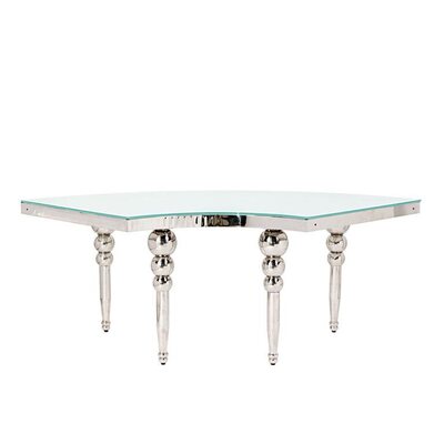 Curved silver table section with polished bubble legs and glass top, shown from the inner side of the arc