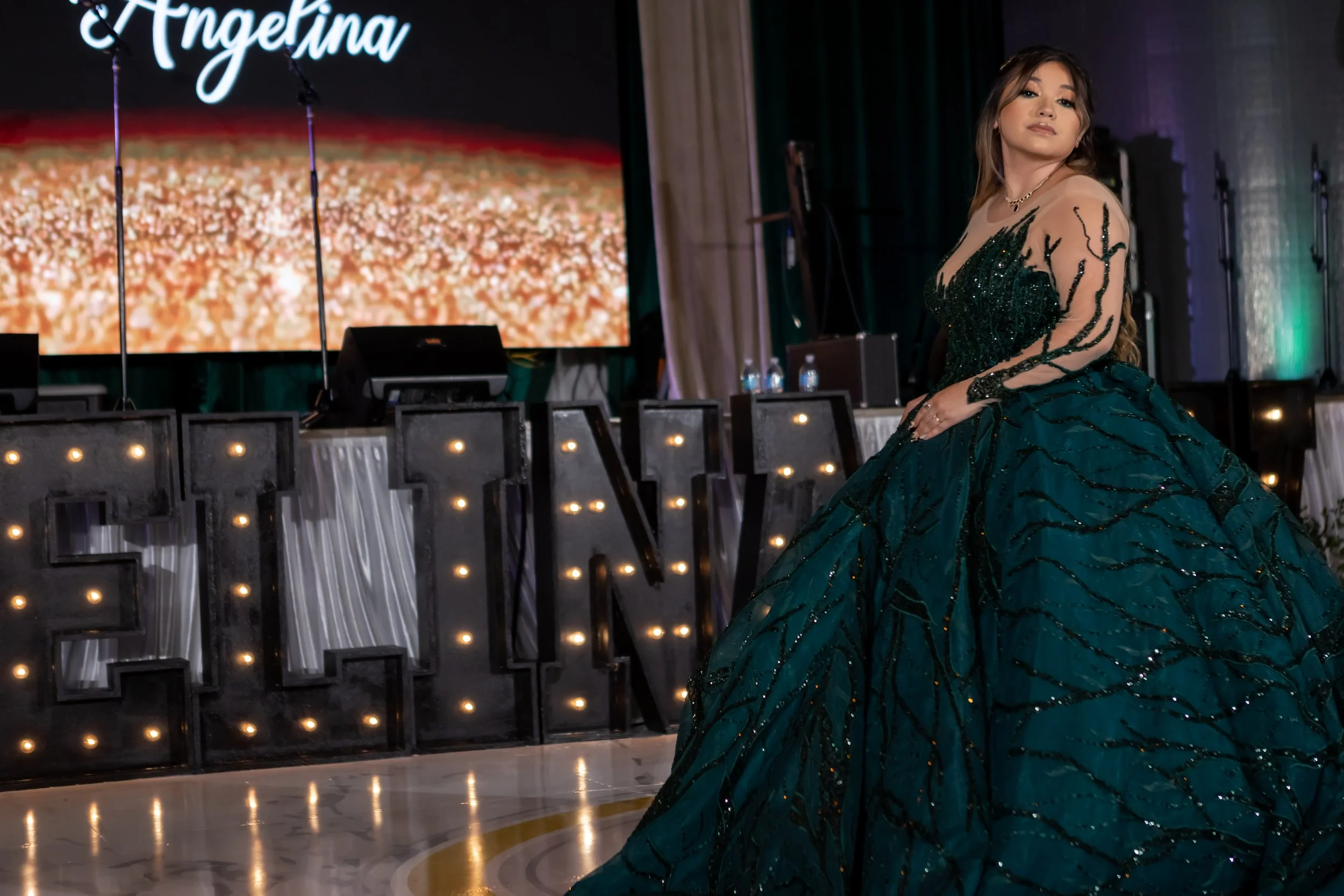 Emerald and black quinceañera with gold accents