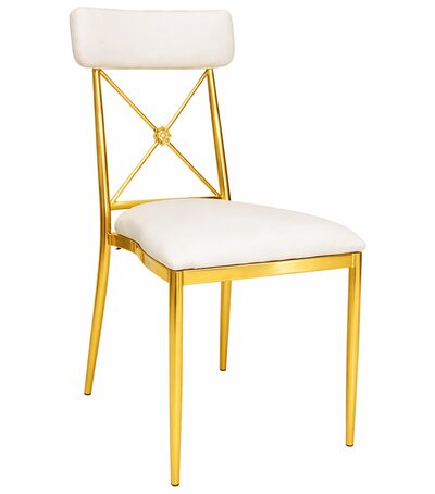 Gold cross-back dining chair with white velvet seat and back cushion, shown at a three-quarter angle