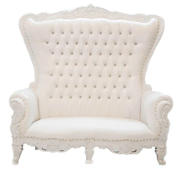 White tufted leather loveseat with high wingback and carved white frame