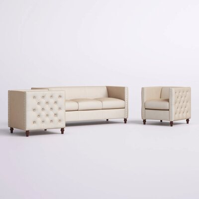 Beige tufted lounge chair arranged beside a matching three-seat sofa, shown together on a plain white backdrop