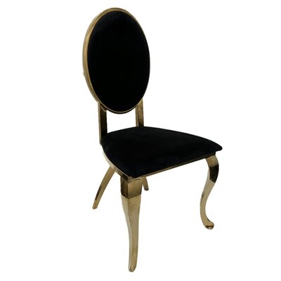 Gold oval-back chair with black velvet seat and back, shown at an angle