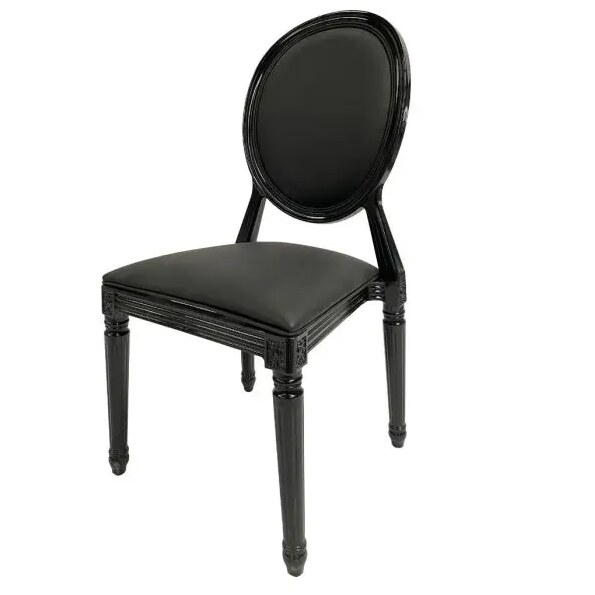 Black Louis XVI dining chair with oval cushioned back, glossy frame and fluted legs