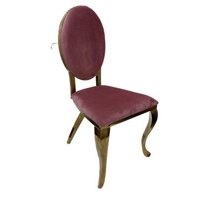Gold oval-back chair upholstered in dusty pink velvet, shown at an angle
