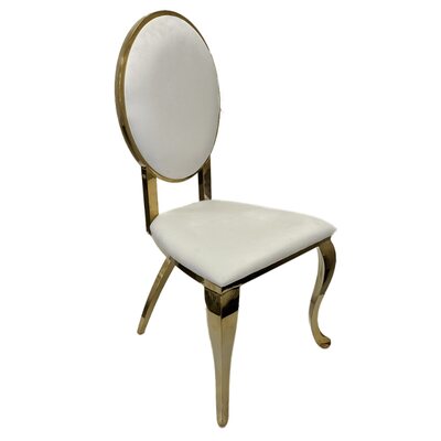 Gold oval-back chair with white velvet seat and back, shown at an angle
