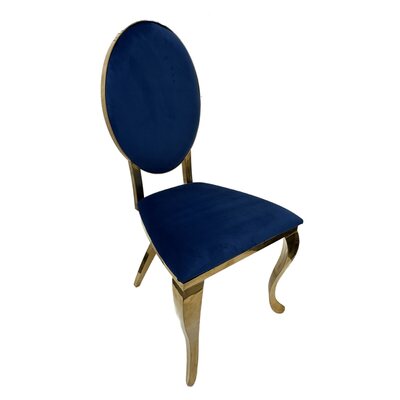 Gold oval-back chair upholstered in navy blue velvet, shown at an angle