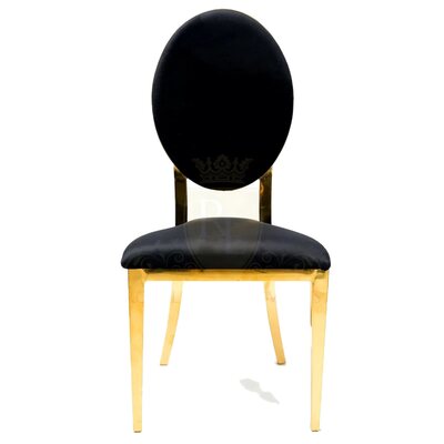 Black velvet dining chair with oval back and slim gold legs, shown straight from the front