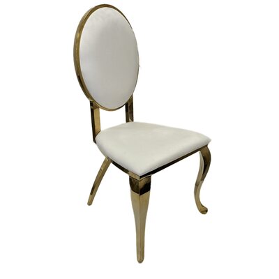 Gold cross leg chair with oval white velvet back and seat, shown at a three-quarter angle