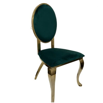 Gold oval-back chair upholstered in deep emerald green velvet, shown at an angle