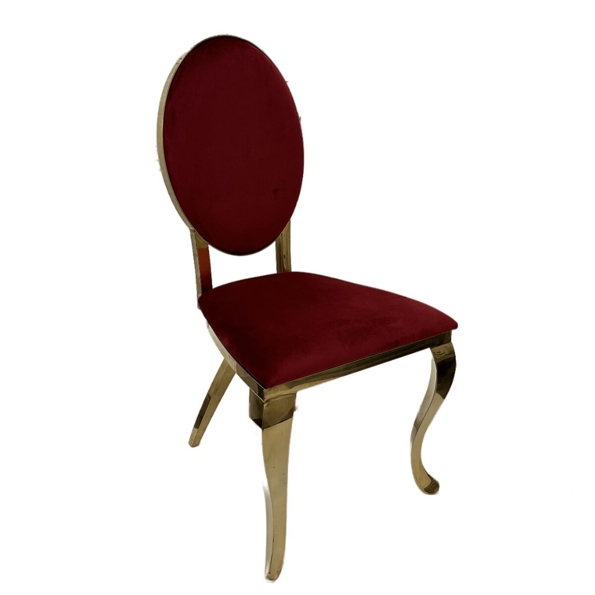 Gold cross leg chair with oval ruby red velvet back and seat, shown at a three-quarter angle